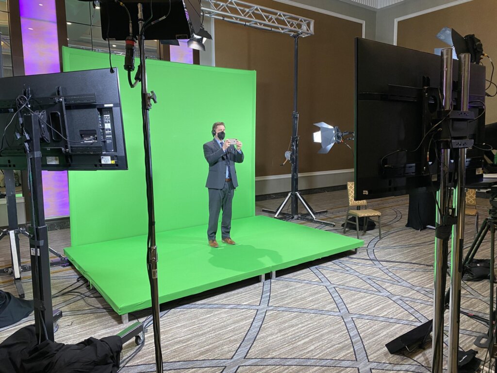 Green screen being used for a corporate virtual event